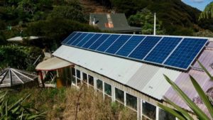 Solar panels, house behind